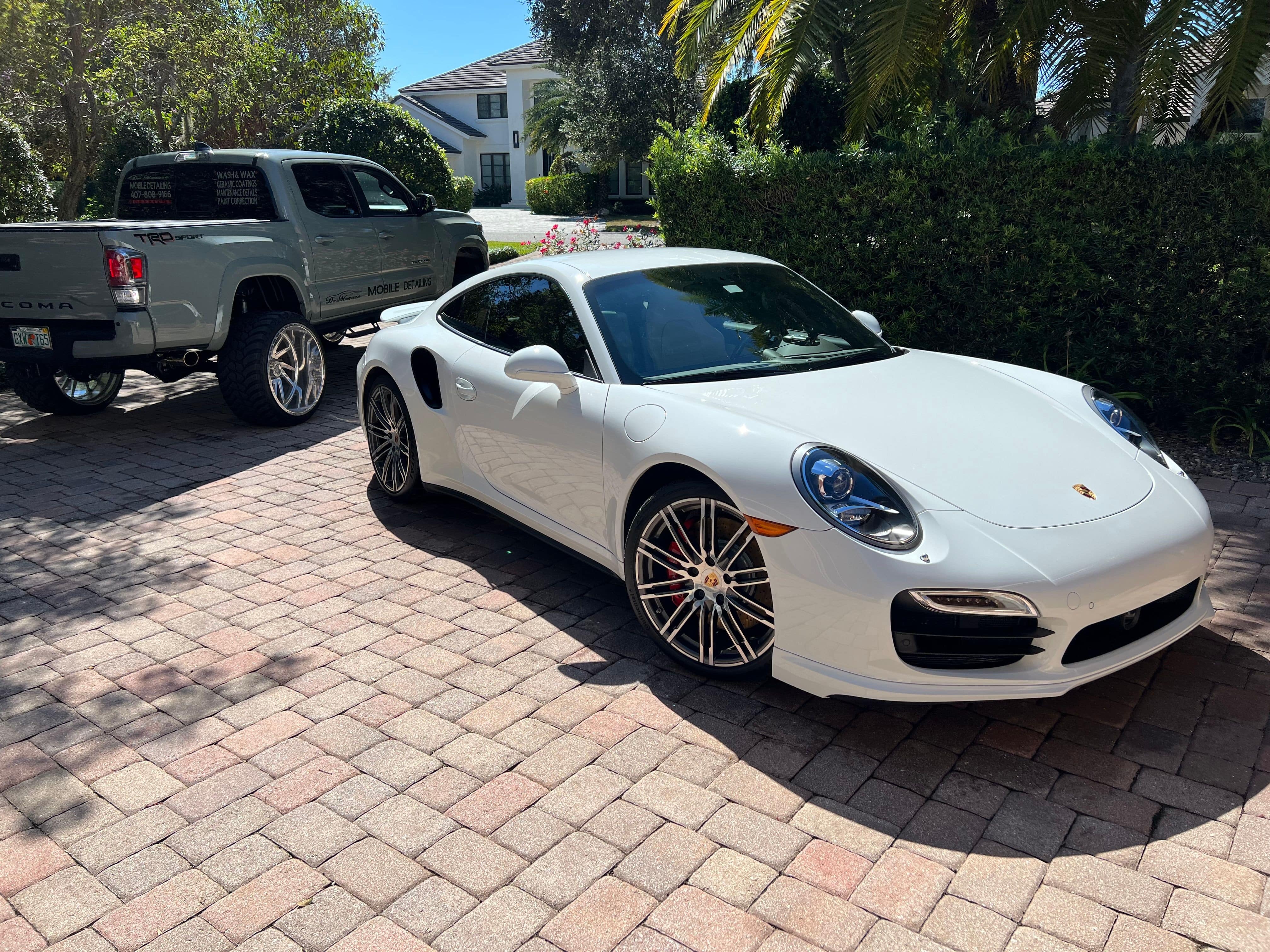 white porsche after completed service